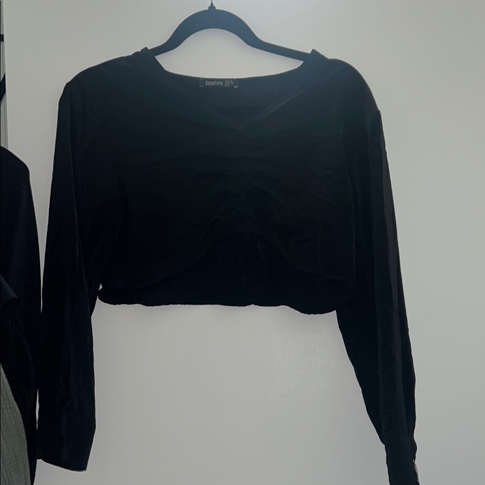 Black crop top, tie front to adjust length. satin ish material